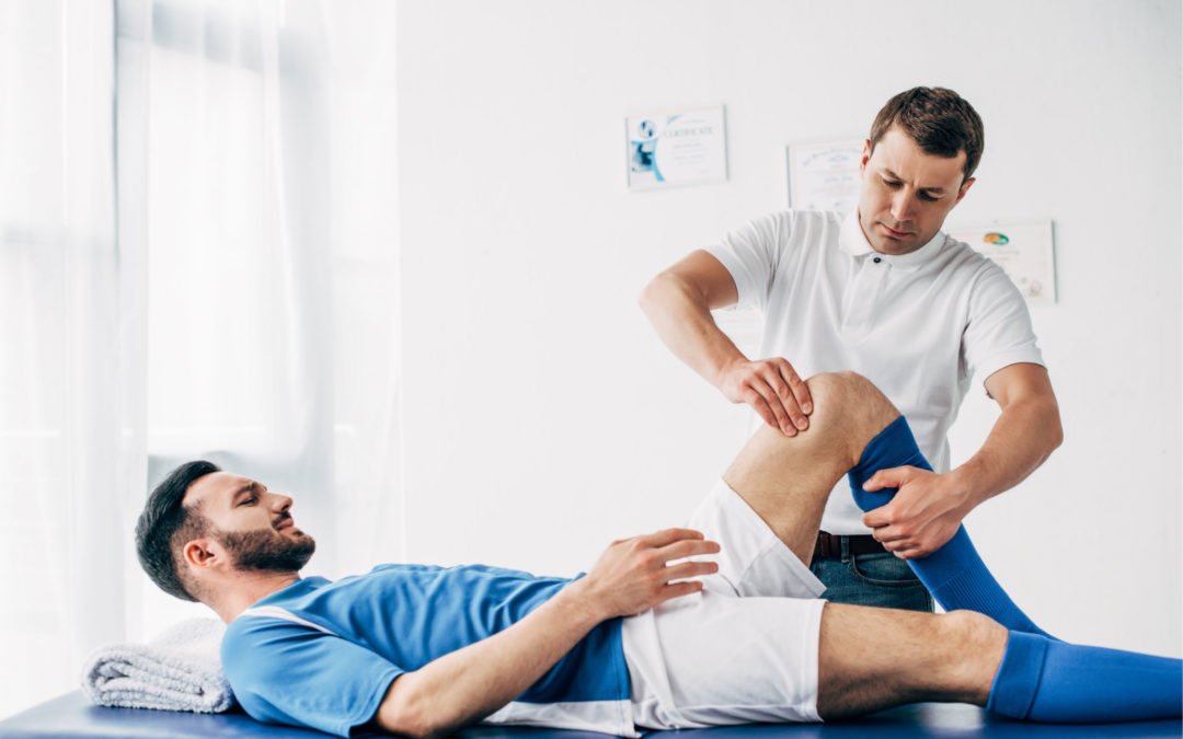 a man receiving physical therapy on a table