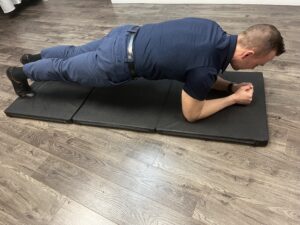 Man doing a plank. One of the recommended exercises to promote core stability