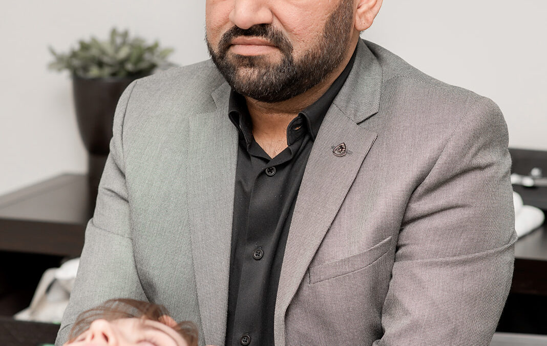 Manual Osteopath, Gagandeep Watts performing Cranial Sacral Therapy on a patient