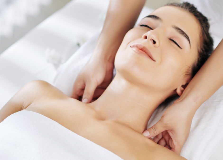 woman receiving a shoulder massage from a registered massage therapist