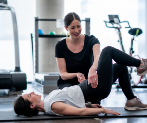 woman doing pelvic floor exercises with a kinesiologist