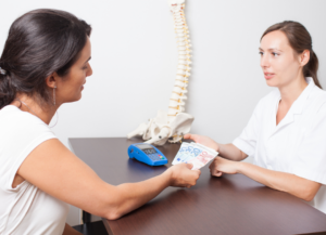 woman paying cash for a massage