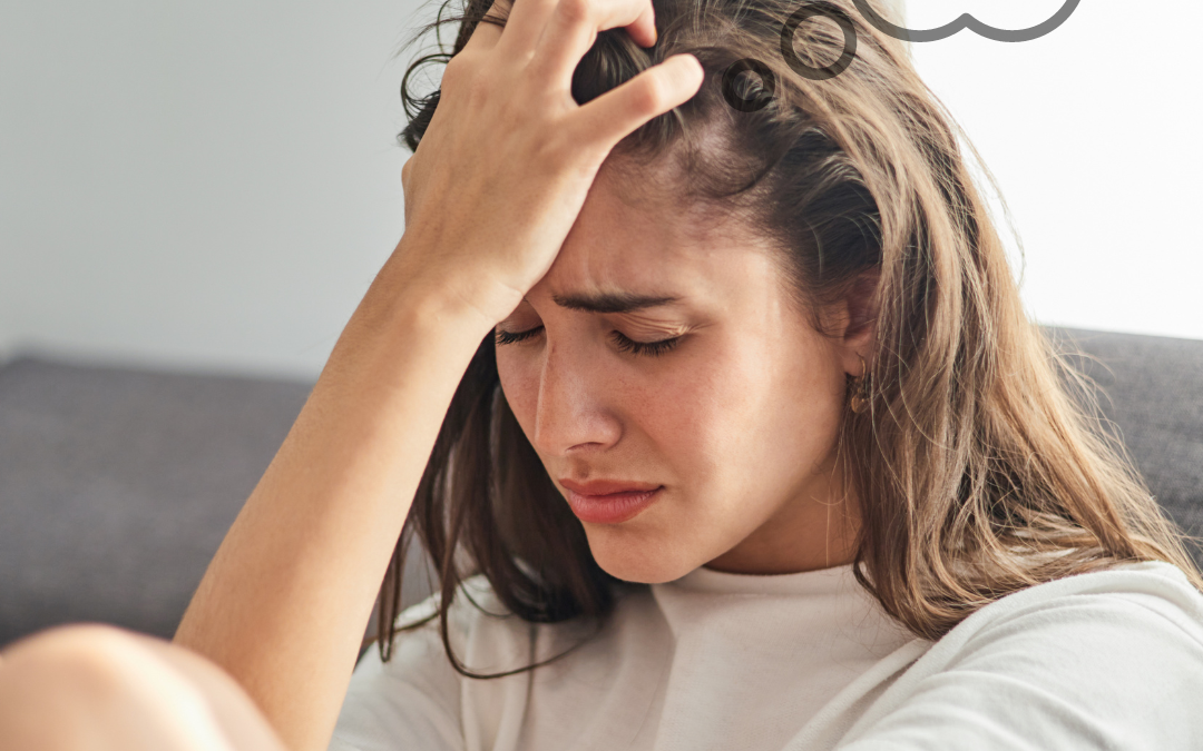 Woman sitting on sofa working through hard emotions