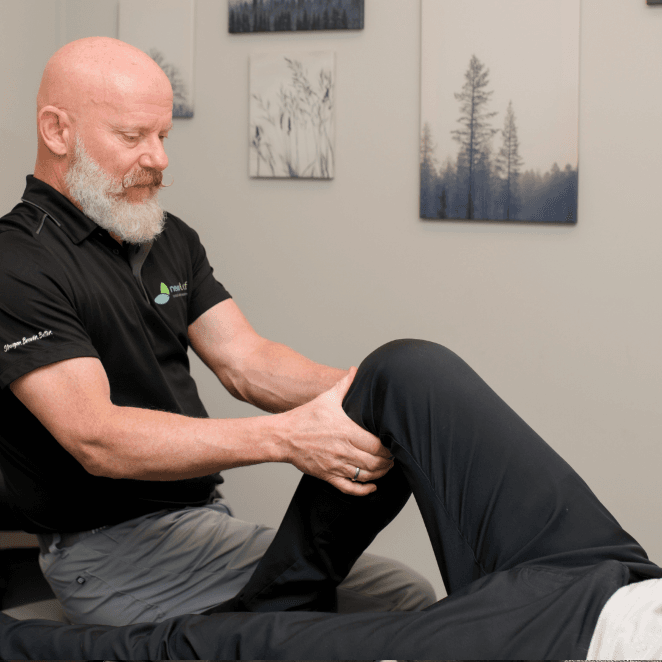 Physiotherapist, Ed working on a patient with a knee injury